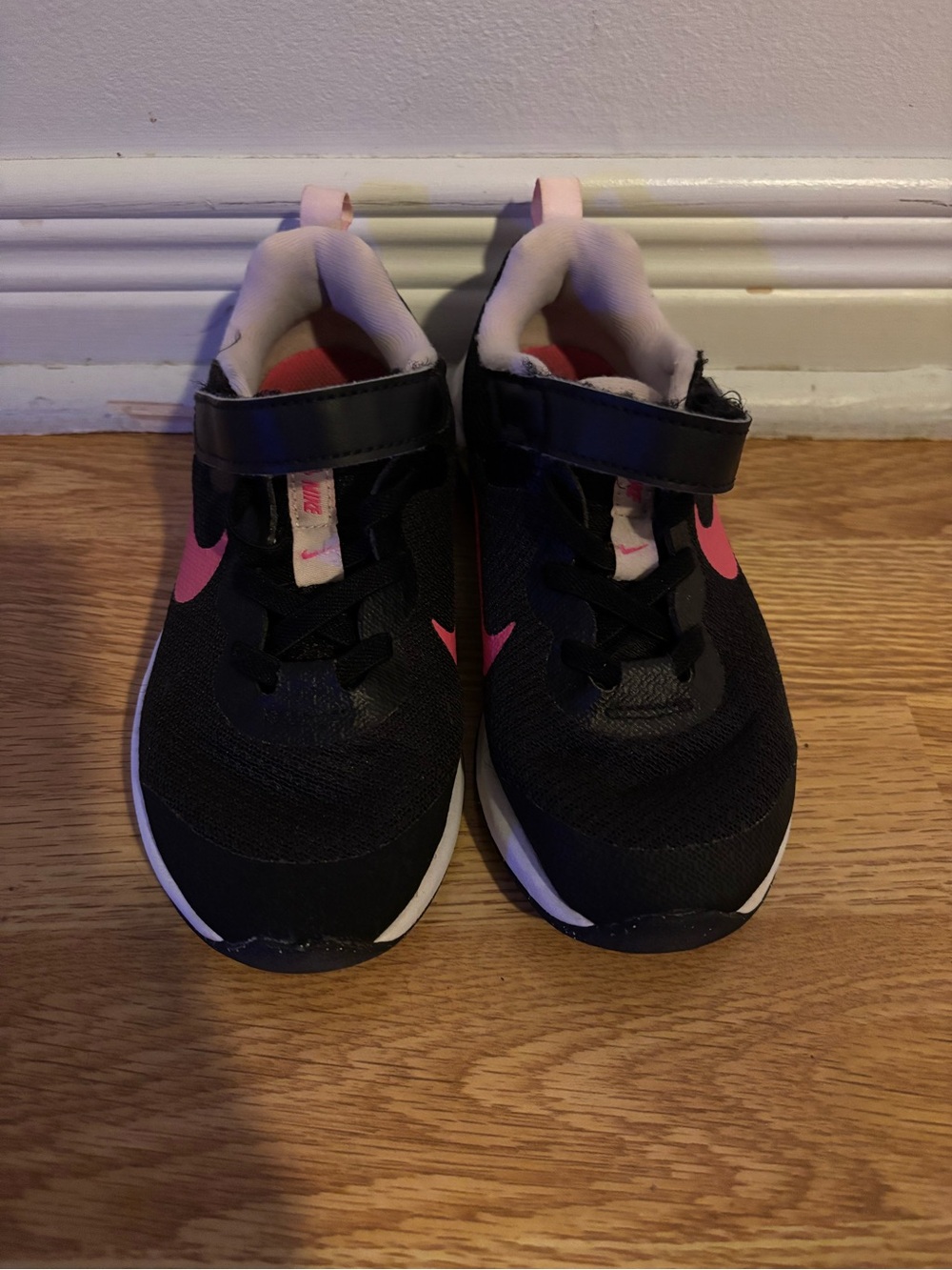 Nike Kids Black Sneakers with Pink Swoosh